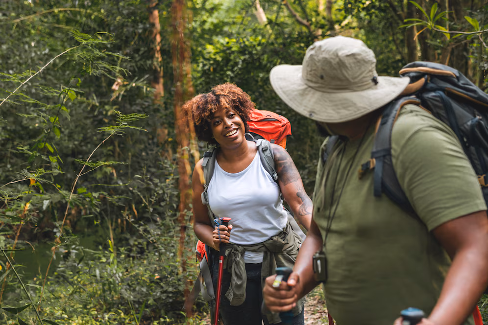 couple trekking forest together 53876 24168