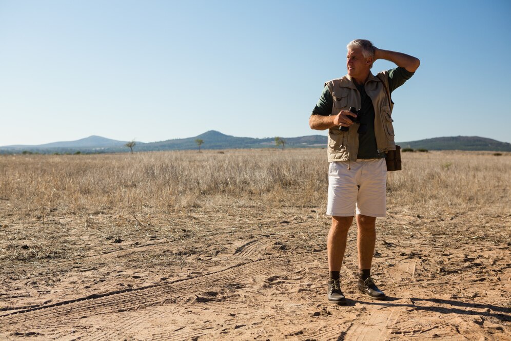 man with binocular looking away while standing landscape 107420 9779